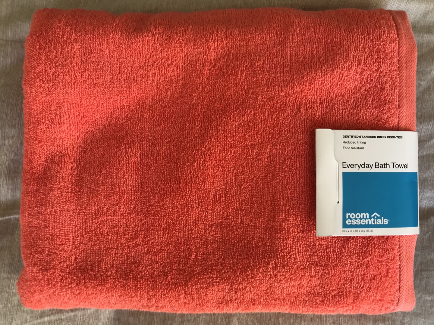 Everyday bath towel lying on bed